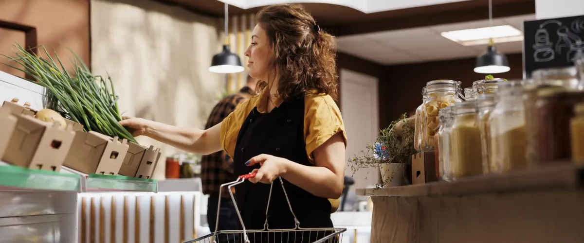 woman in local eco store buys food